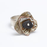 Marianne Willumsen | Ring with Mokume-gane shapes and beach pebble