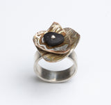 Marianne Willumsen | Ring with Mokume-gane shapes and beach pebble
