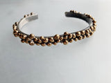 Nature inspired with organic styling on a simple oxidized silver cuff with a bronze seed-like nodules.
