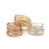 hammered coil rings in golds and silver