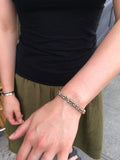 Nature inspired with organic styling on a simple oxidized silver cuff with a bronze seed-like nodules.